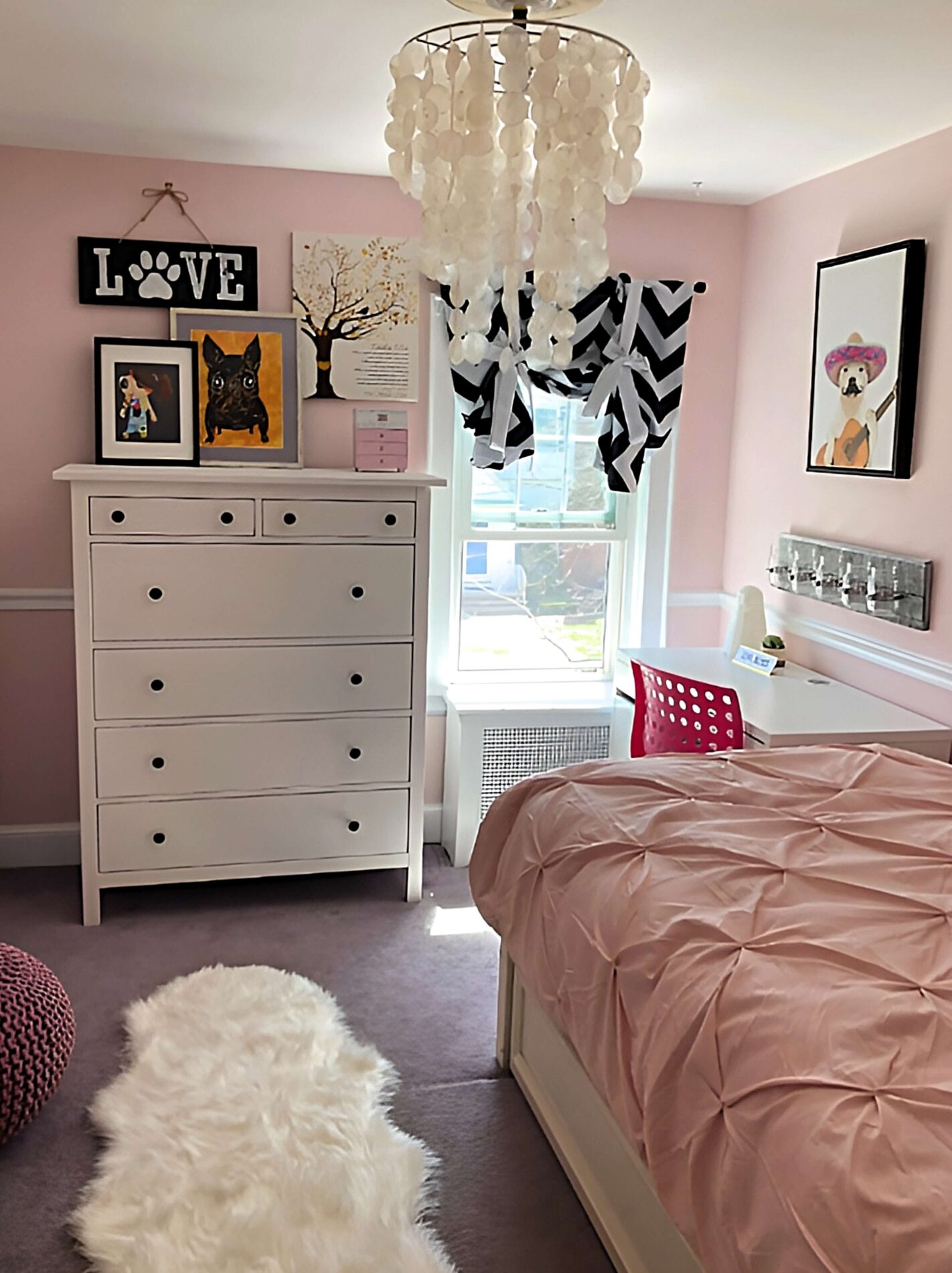 bedroom with pink walls and pink bedding