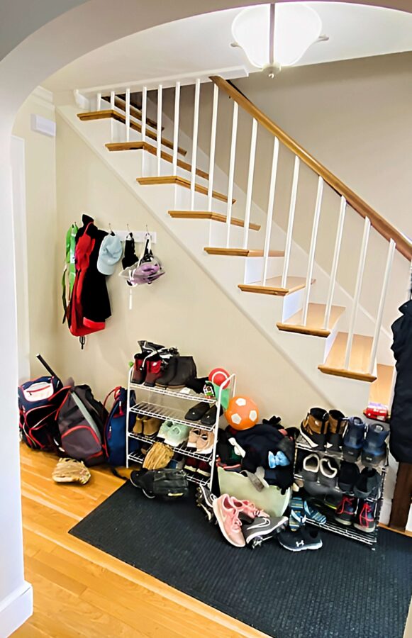 cluttered-hallway-with-clothes-and-shoes